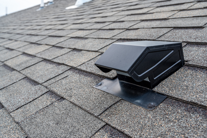 Static vent installed on a shingle roof for passive attic ventilation Dakventilatie
